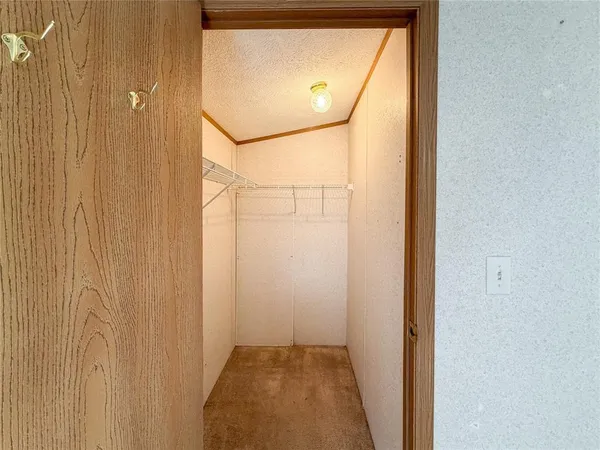 a bathroom with a granite countertop shower sink and mirror