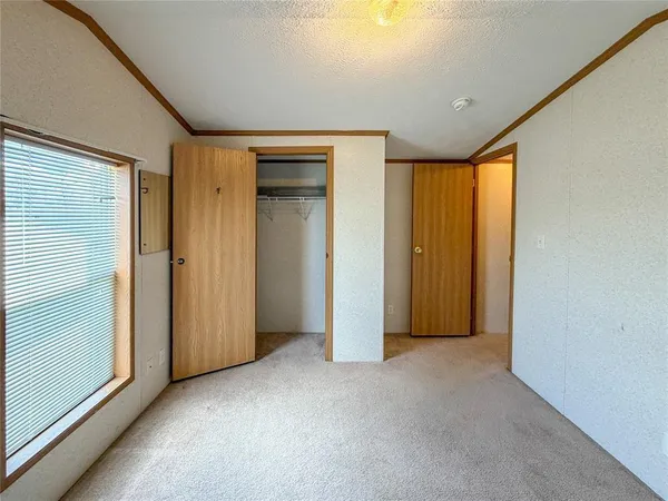 a view of a bathroom from a hallway