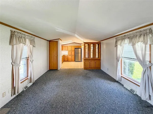 a view of an empty room with a window