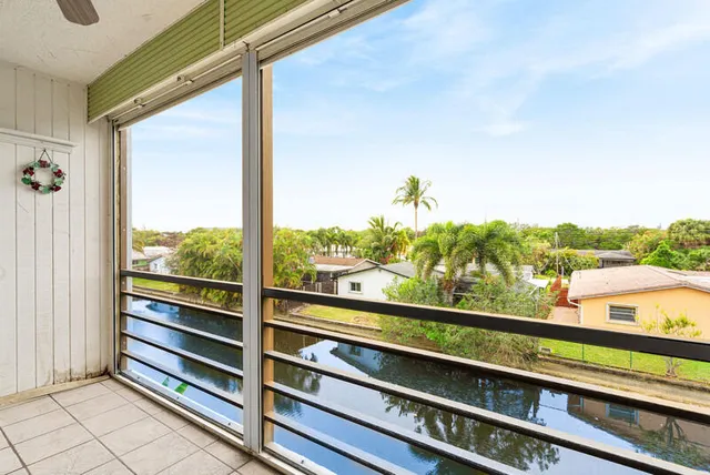 a view of a balcony with chairs