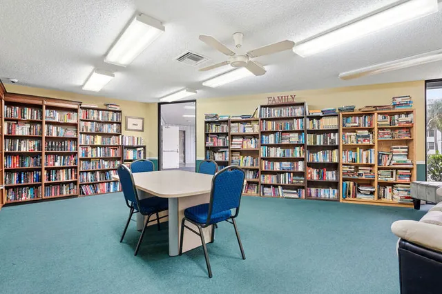 a view of a livingroom with furniture and chandelier