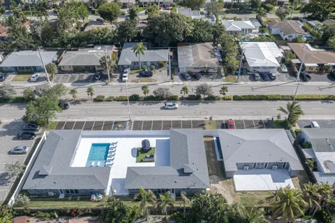 an aerial view of a house with outdoor space