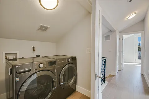 a view of a storage & utility room with washer and dryer
