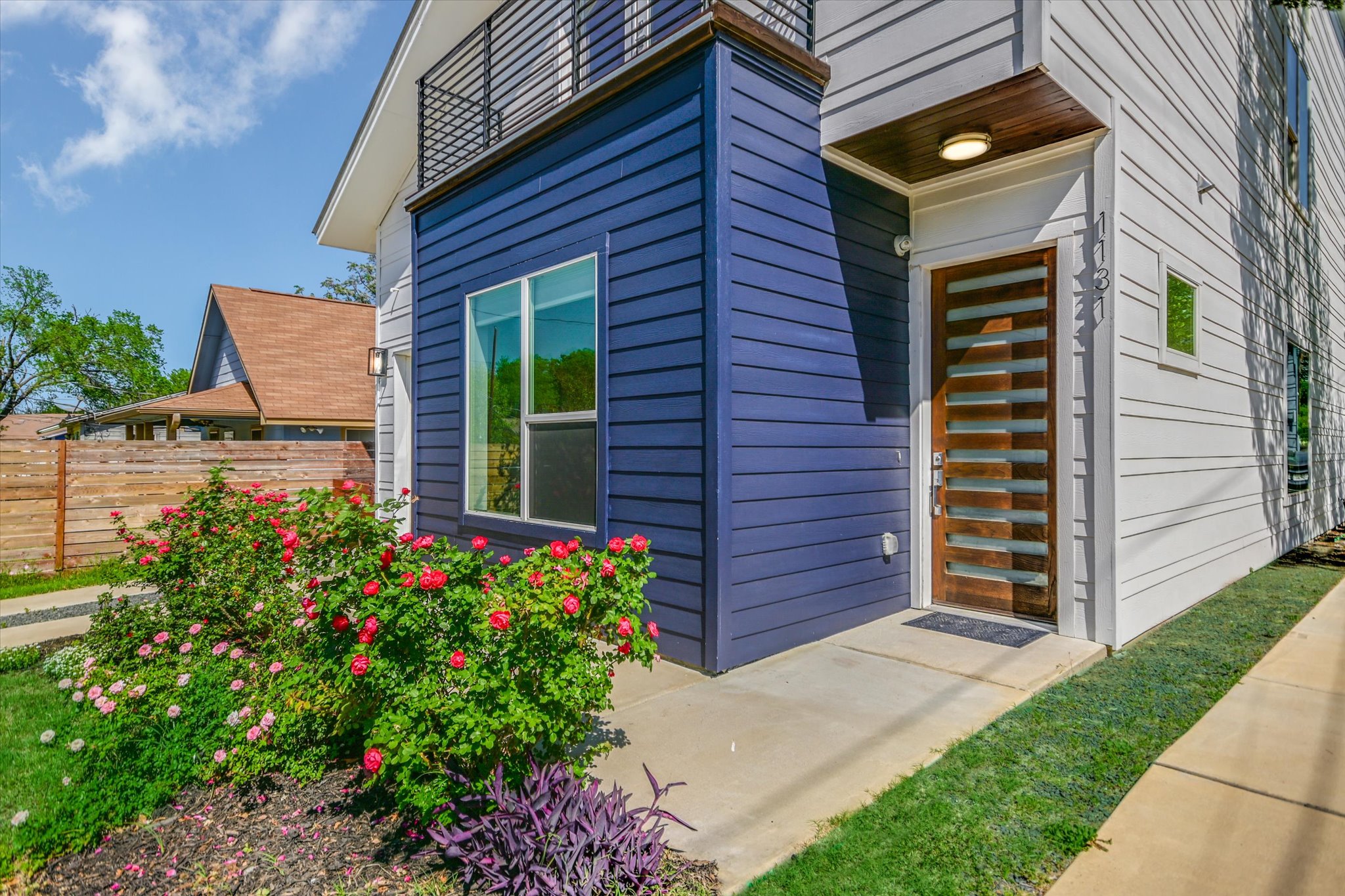 1131 Mason Avenue, Unit A Austin, TX 78721 - Photo 2 of 24 a front view of a house with a garden