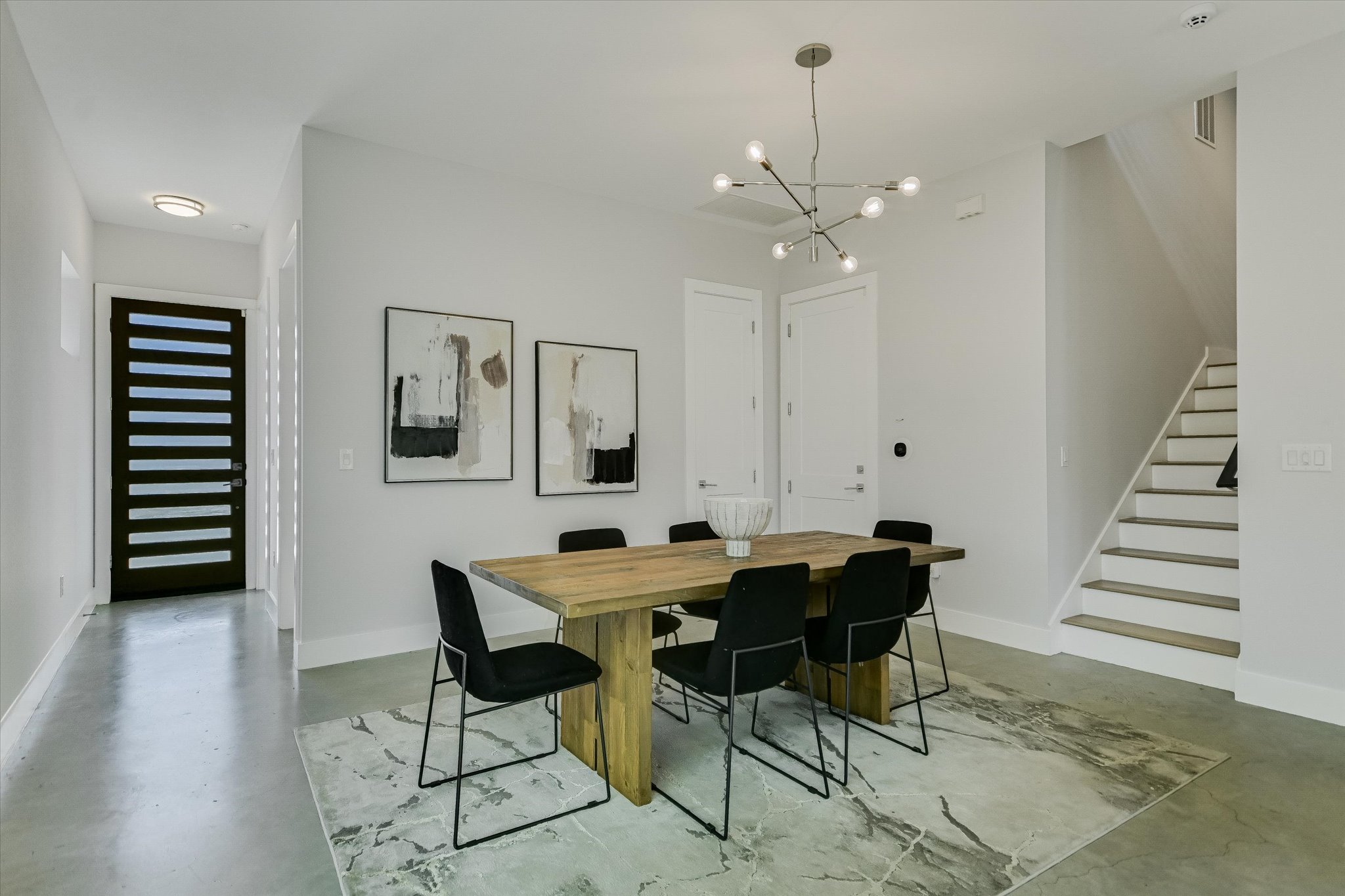 1131 Mason Avenue, Unit A Austin, TX 78721 - Photo 4 of 24 a view of a dining room with furniture and wooden floor