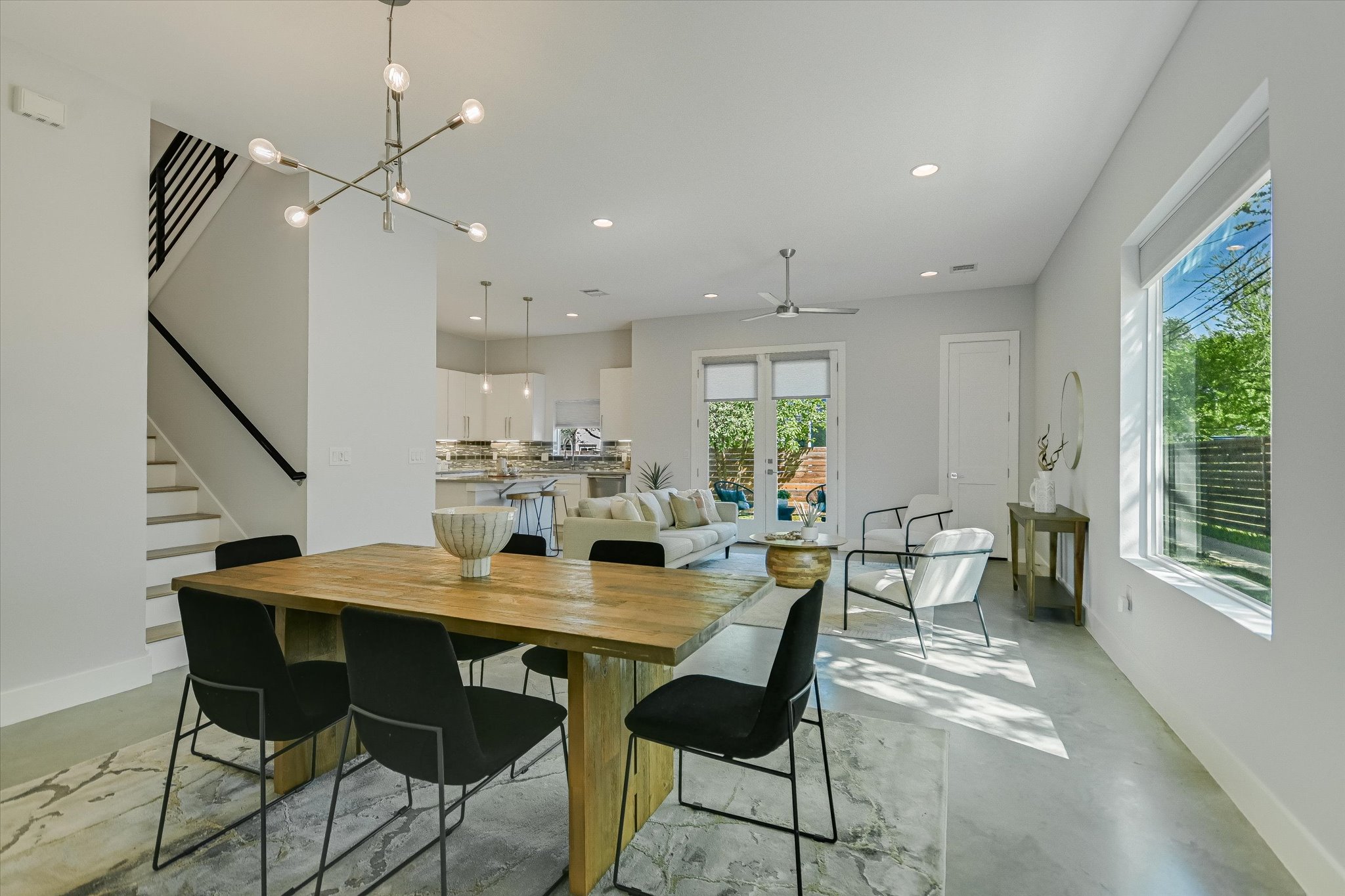 1131 Mason Avenue, Unit A Austin, TX 78721 - Photo 5 of 24 a view of a dining room with furniture window and outside view