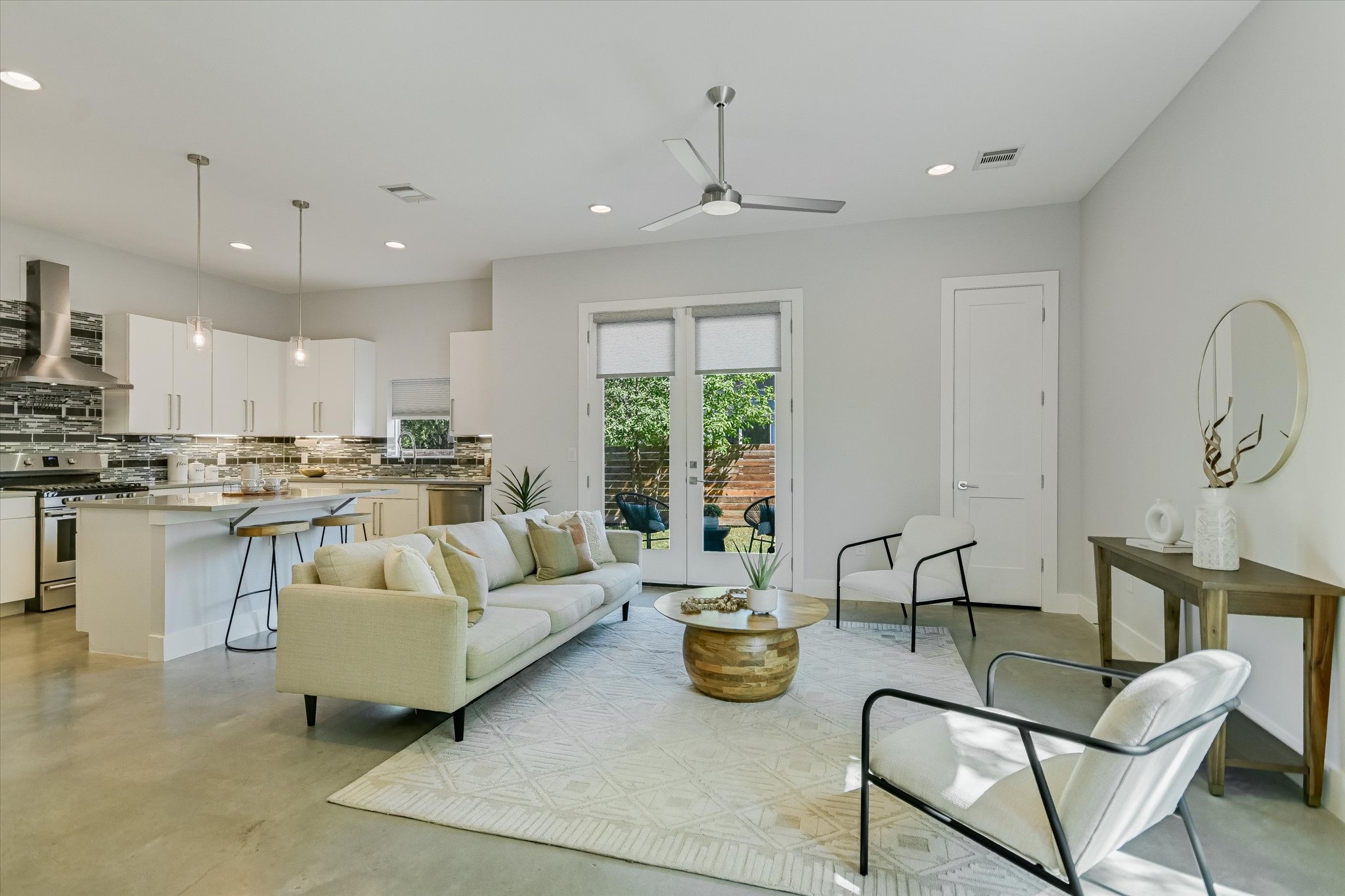 1131 Mason Avenue, Unit A Austin, TX 78721 - Photo 6 of 24 a living room with furniture kitchen and a large window
