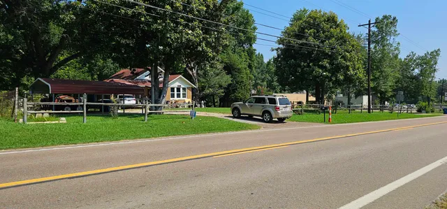 a view of a parked cars in front of a house