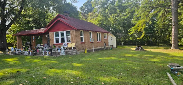 a view of a house with a yard porch and sitting area