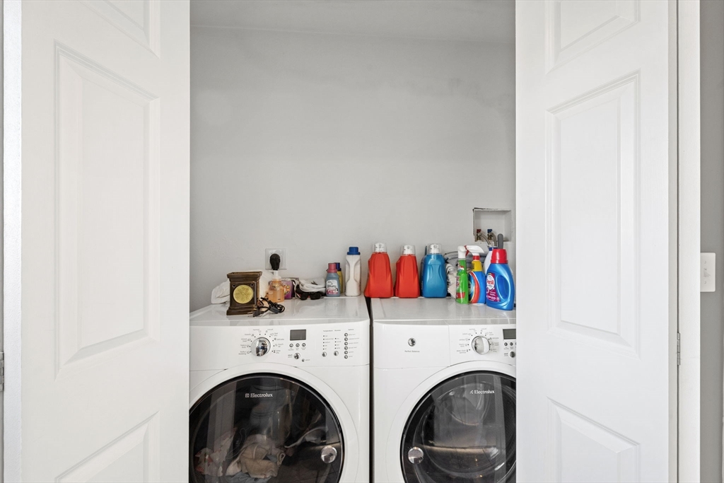 358 Reed Road Mason, NH 03048 - Photo 22 of 42 a utility room with dryer and washer
