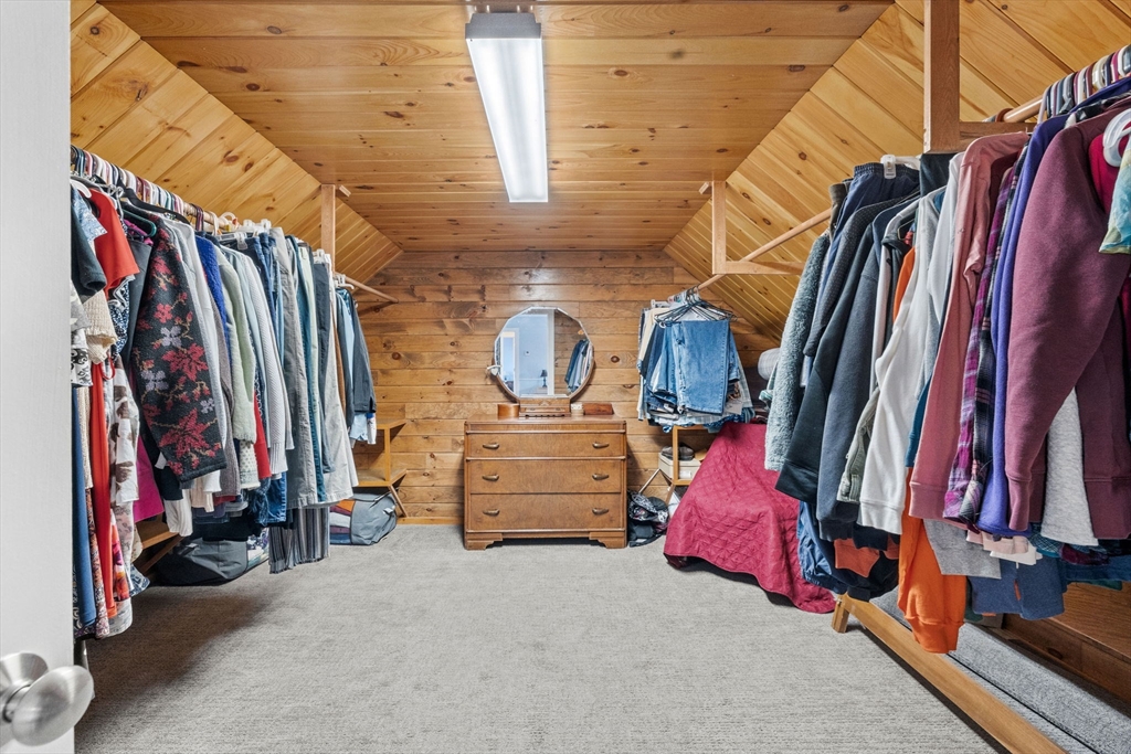 358 Reed Road Mason, NH 03048 - Photo 27 of 42 a view of walk in closet with clothes and shoes