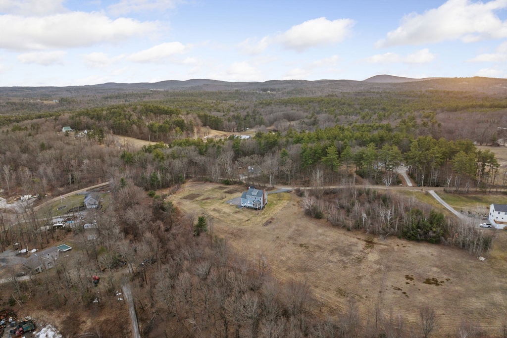 358 Reed Road Mason, NH 03048 - Photo 40 of 42 a view of a dry yard with green space