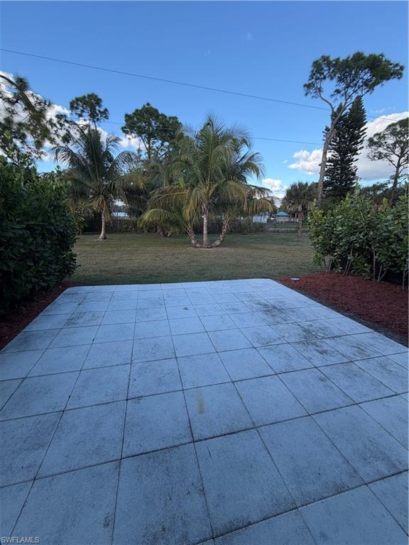 3619 Poplar Way, Unit B Naples, FL 34112 - Photo 2 of 17 a view of a yard