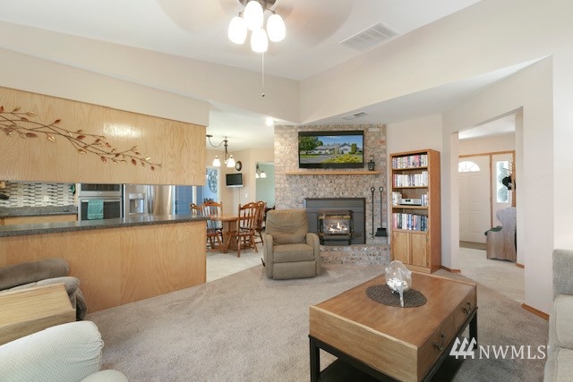 8970 Postma Road Moxee, WA 98936 - Photo 16 of 31 a living room with furniture and a fireplace
