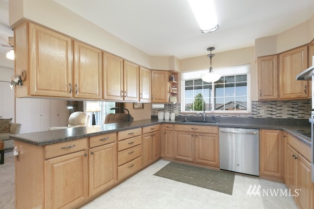 8970 Postma Road Moxee, WA 98936 - Photo 18 of 31 a kitchen with stainless steel appliances granite countertop a sink and cabinets