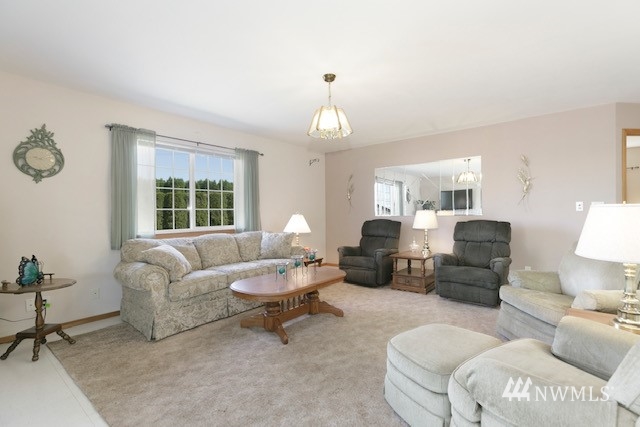 8970 Postma Road Moxee, WA 98936 - Photo 24 of 31 a living room with furniture a lamp and a window