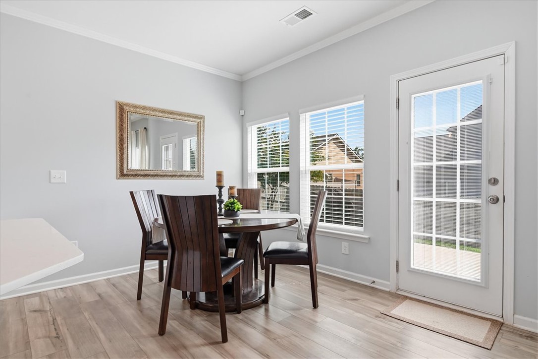 208 Grassy Creek Way Pendleton, SC 29670 - Photo 14 of 43 A well-lit dining area featuring a direct access door to the outside, perfect for indoor-outdoor living.