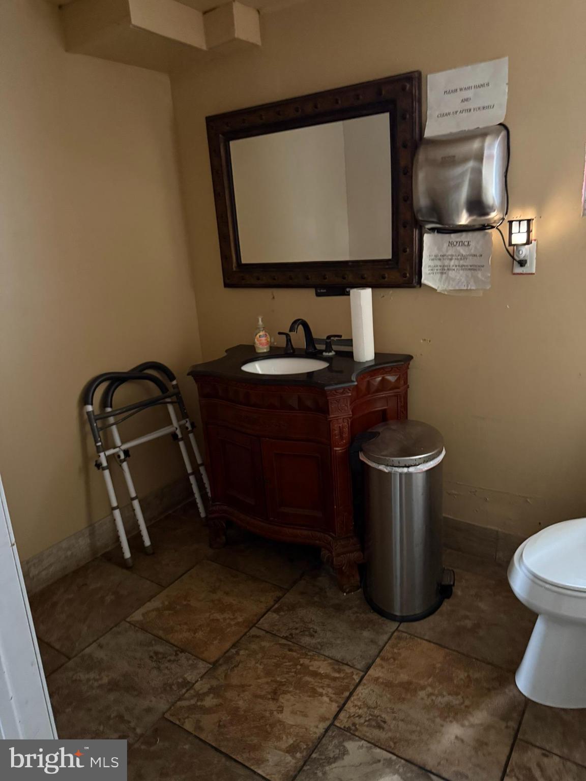 16 North 9th Street Darby, PA 19023 - Photo 18 of 20 a room with water heater and racks