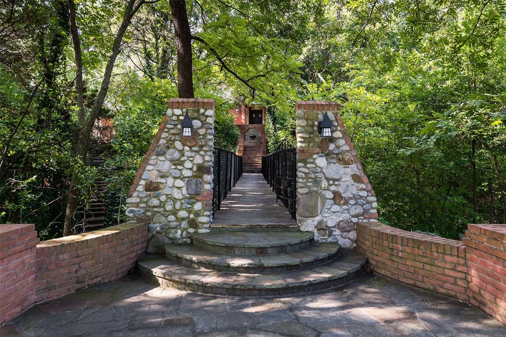 a view of a yard with large trees