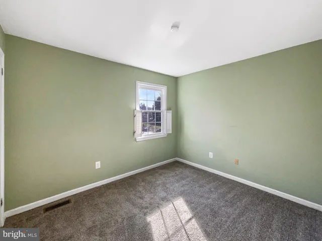 a view of empty room with windows