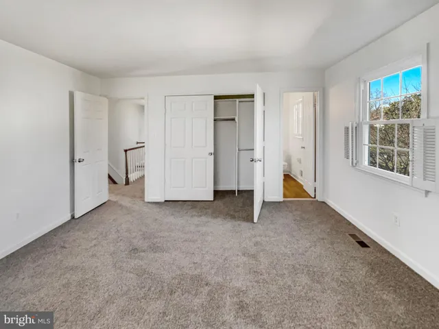 a view of empty room with windows