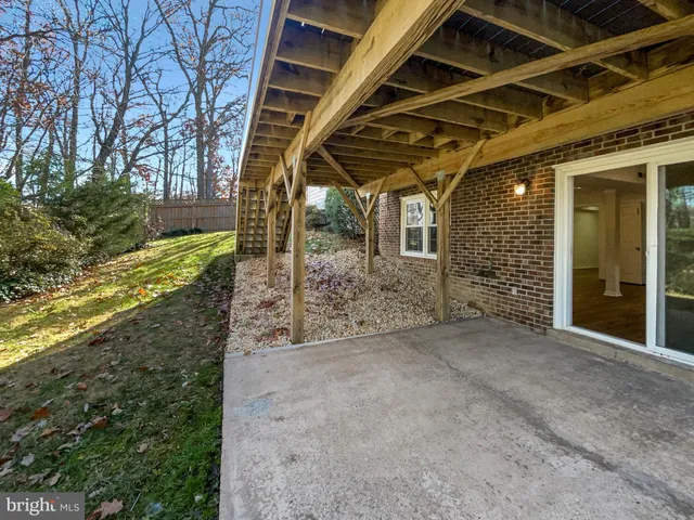 a street sign on a sidewalk next to a road