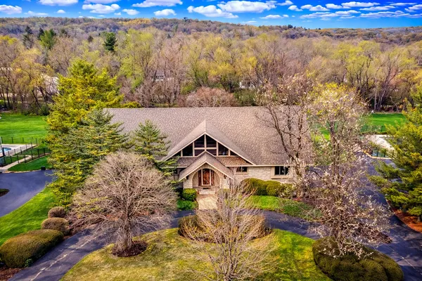 a aerial view of a house with a yard