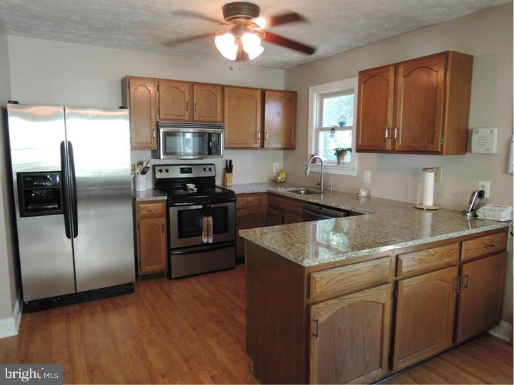3439 Brookhaven Road Pasadena, MD 21122 - Photo 4 of 5 Kitchen with granite and SS appliances