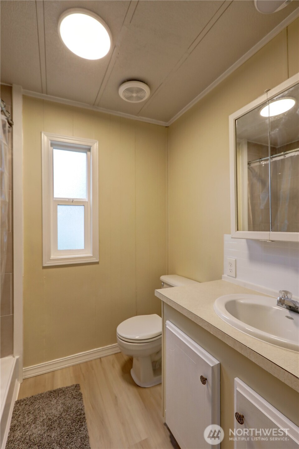 32501 Northeast 50th Street, Unit 6 Carnation, WA 98014 - Photo 12 of 13 a bathroom with a sink a toilet and mirror