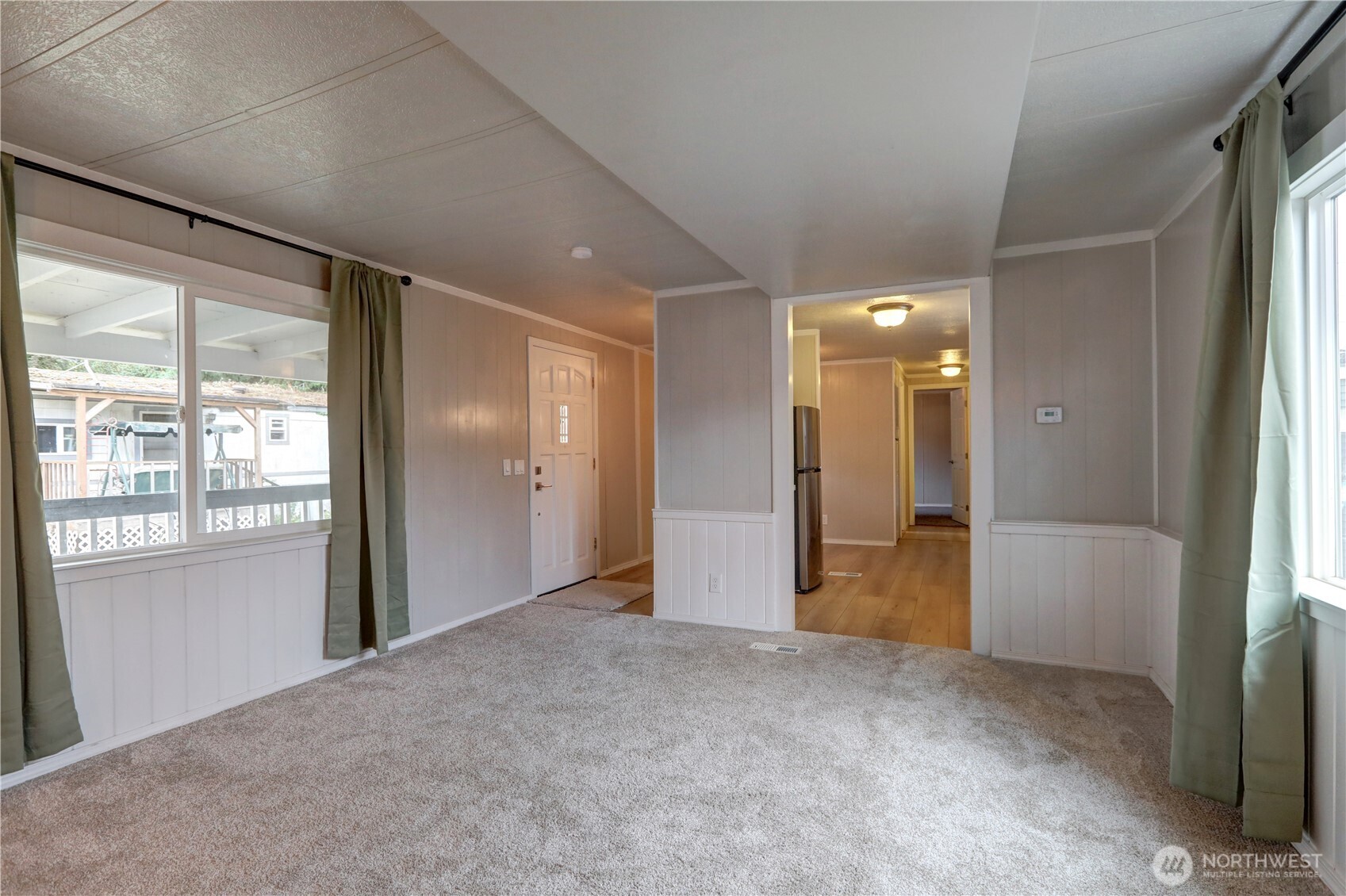 32501 Northeast 50th Street, Unit 6 Carnation, WA 98014 - Photo 5 of 13 a view of empty room with windows and bathroom view
