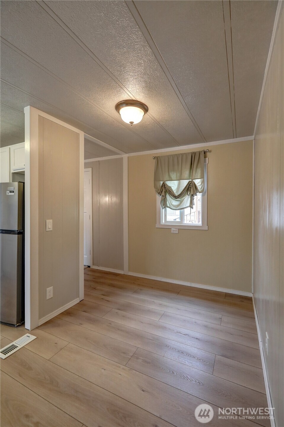 32501 Northeast 50th Street, Unit 6 Carnation, WA 98014 - Photo 8 of 13 an empty room with wooden floor cabinet and closet
