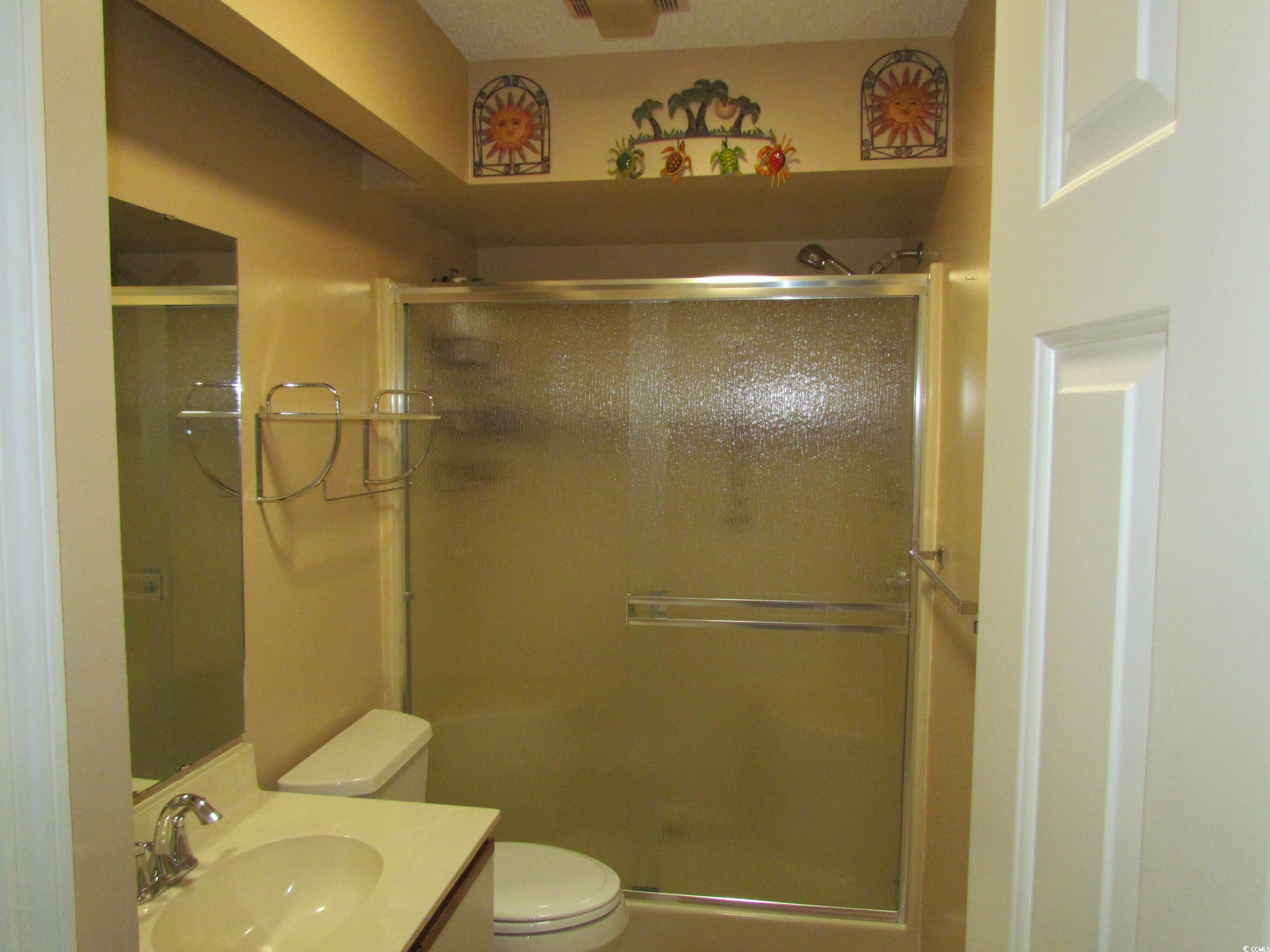 100 Inverness Court Myrtle Beach, SC 29588 - Photo 16 of 22 Bathroom featuring vanity and a shower stall