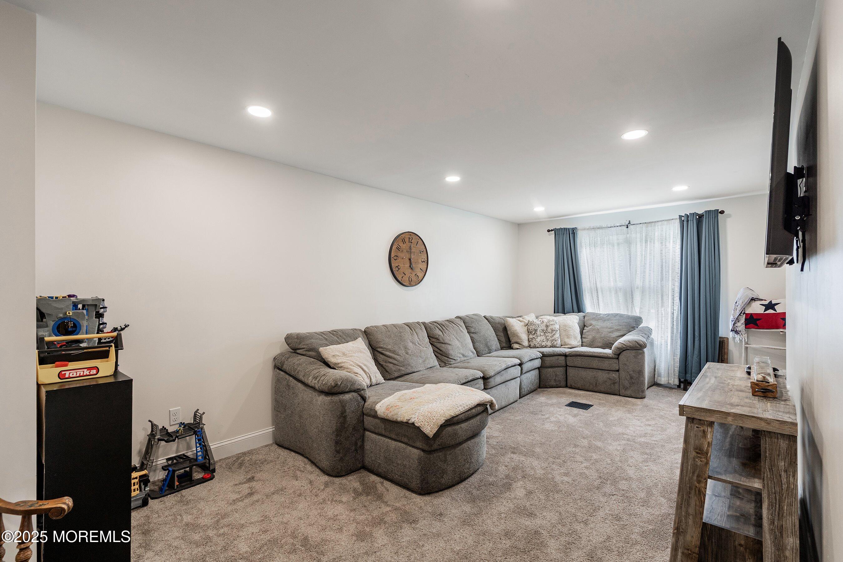 92 Jacobstown Road New Egypt, NJ 08533 - Photo 11 of 27 a living room with furniture and a flat screen tv