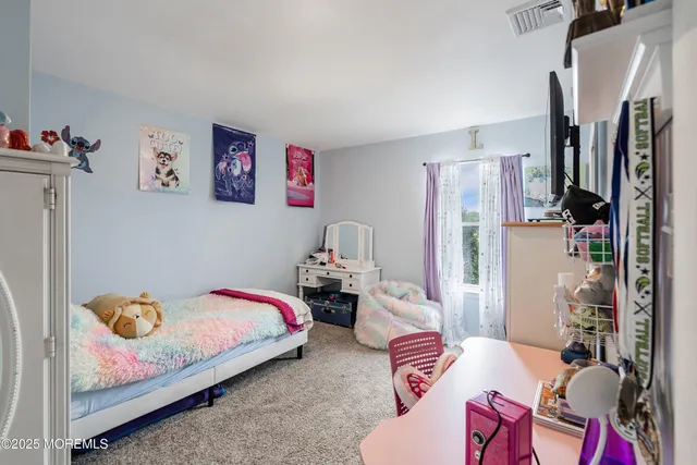 a bedroom with furniture and a couch