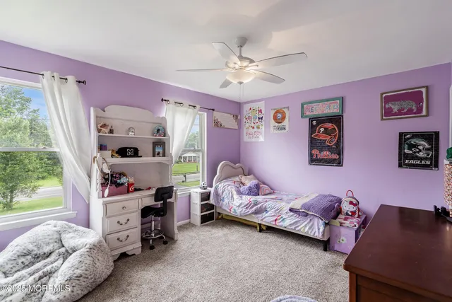 a bedroom with bed and a window