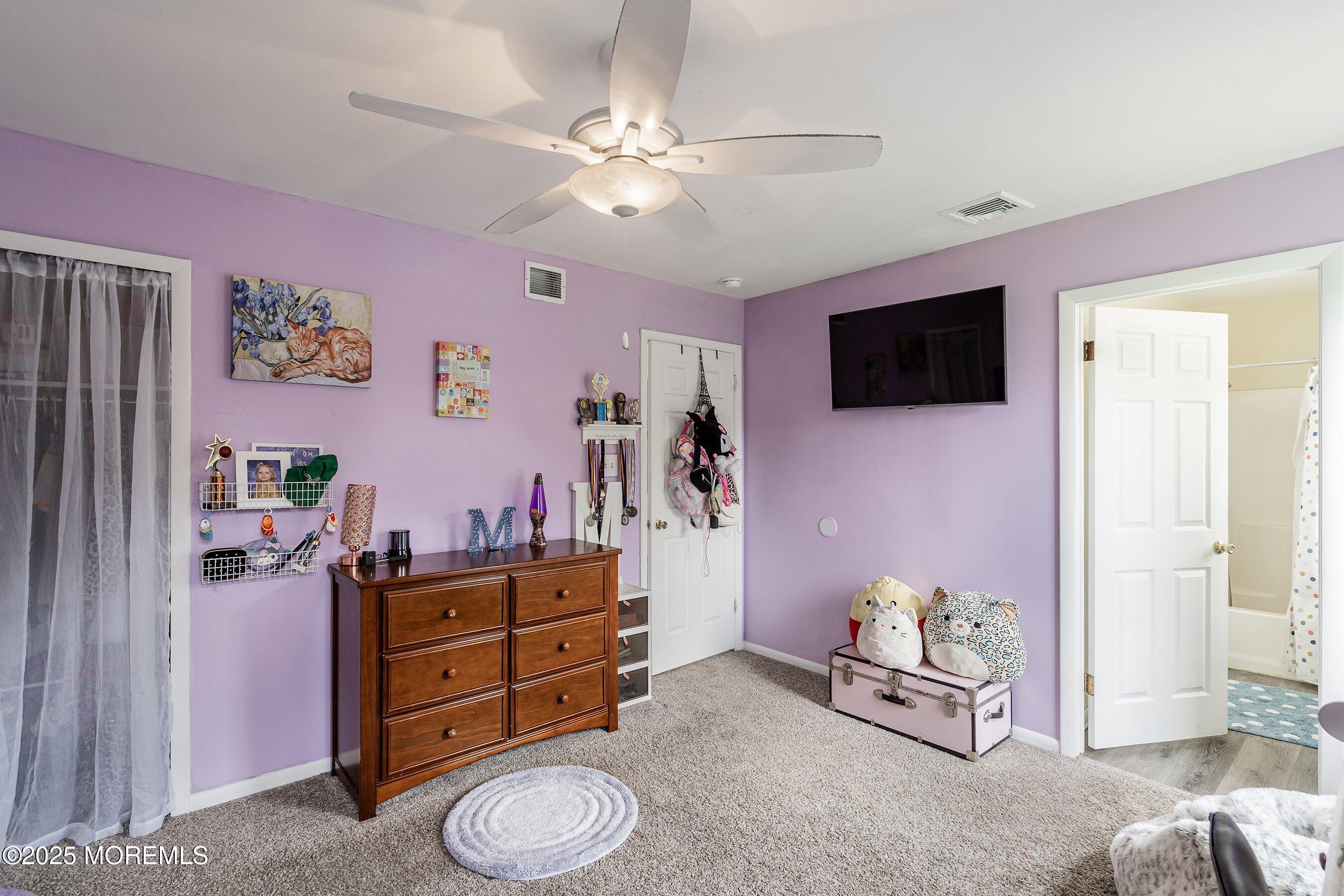 92 Jacobstown Road New Egypt, NJ 08533 - Photo 21 of 27 a living room with furniture and a flat screen tv