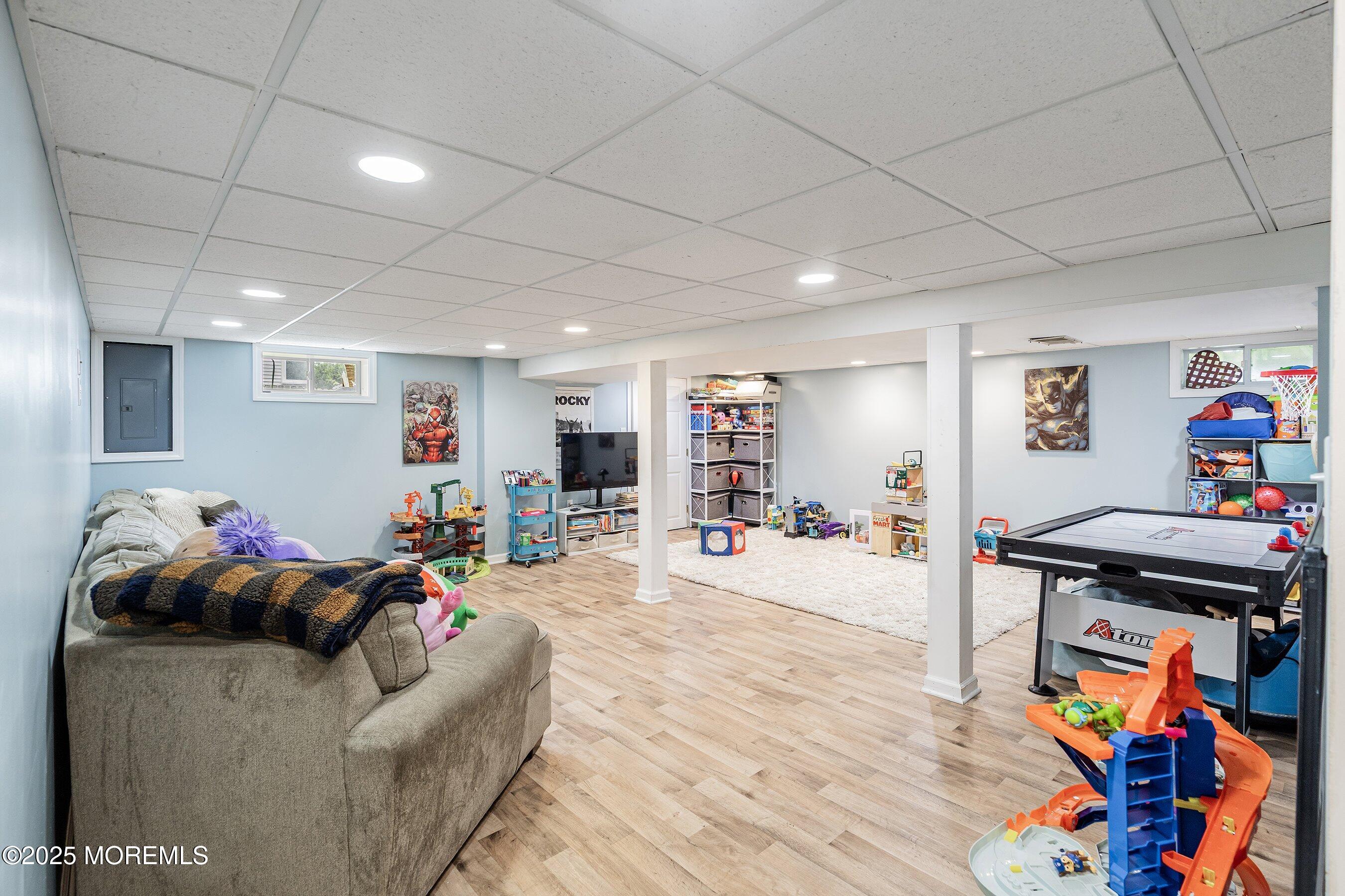 92 Jacobstown Road New Egypt, NJ 08533 - Photo 23 of 27 a living room with furniture and a flat screen tv