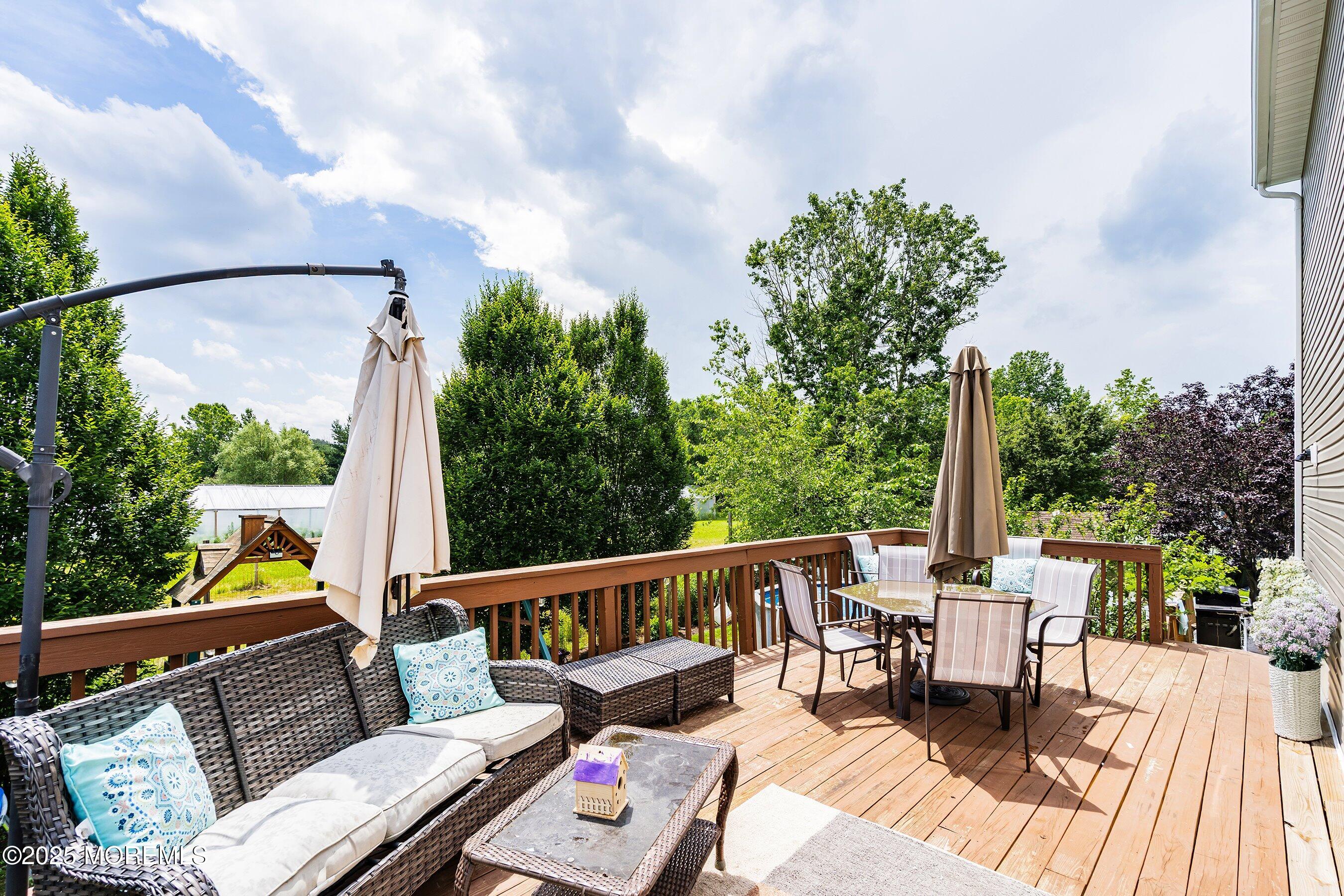 92 Jacobstown Road New Egypt, NJ 08533 - Photo 24 of 27 a view of balcony with wooden floor and outdoor seating