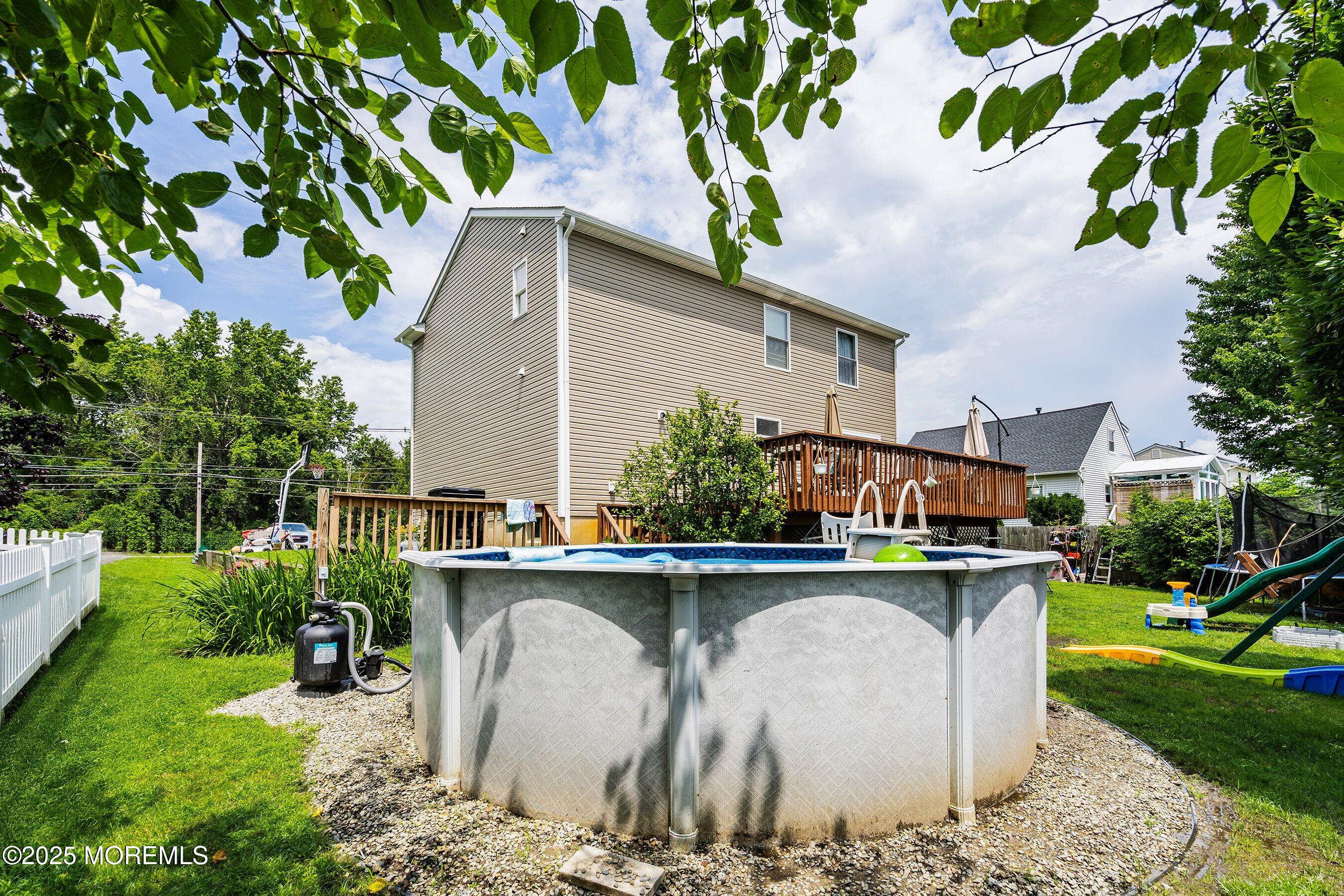 92 Jacobstown Road New Egypt, NJ 08533 - Photo 26 of 27 a view of a patio with table and chairs potted plants and large tree