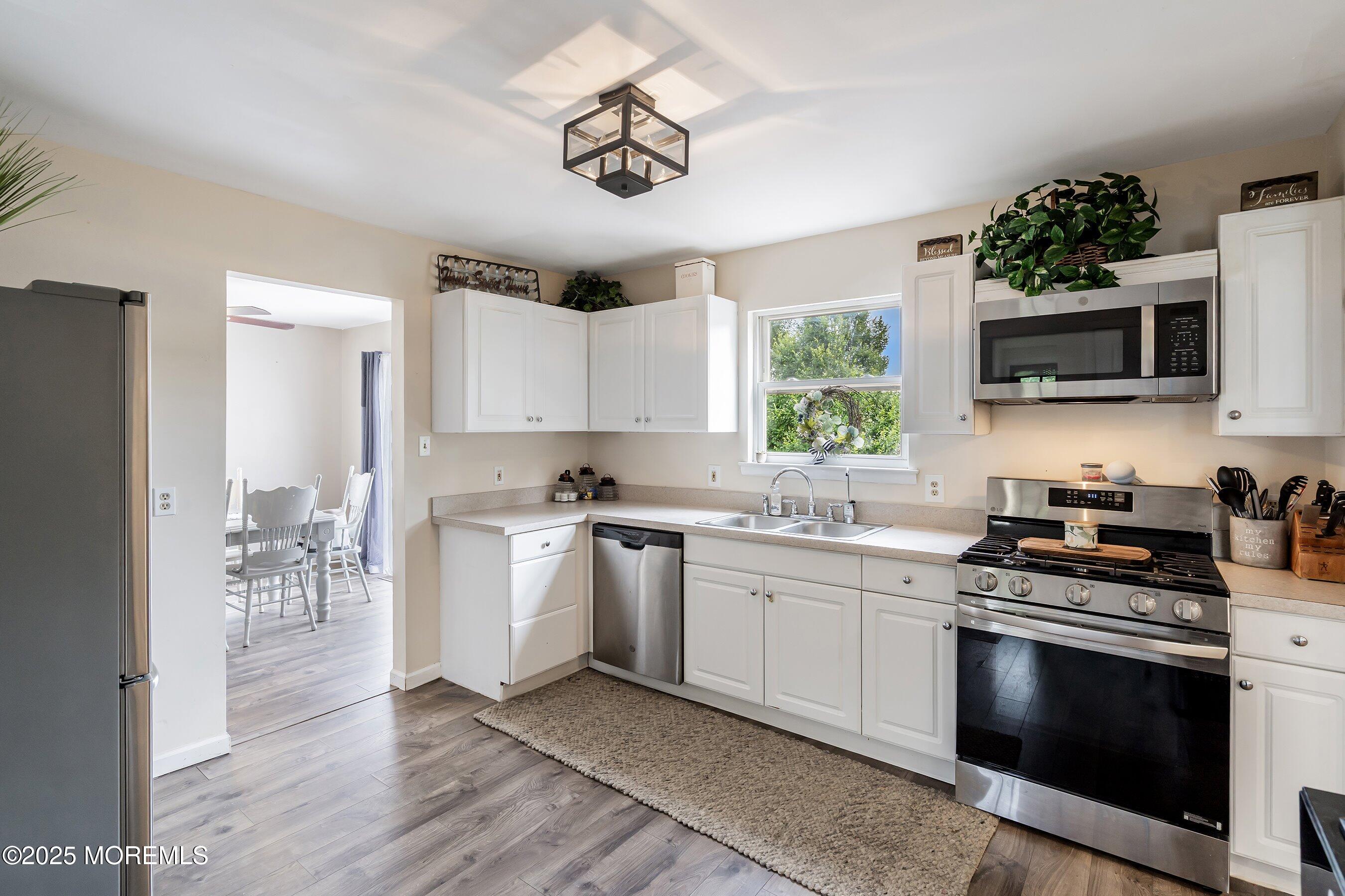 92 Jacobstown Road New Egypt, NJ 08533 - Photo 9 of 27 a kitchen with a sink stove and microwave