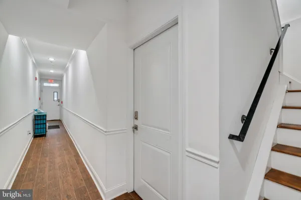 a view of entryway with wooden floor