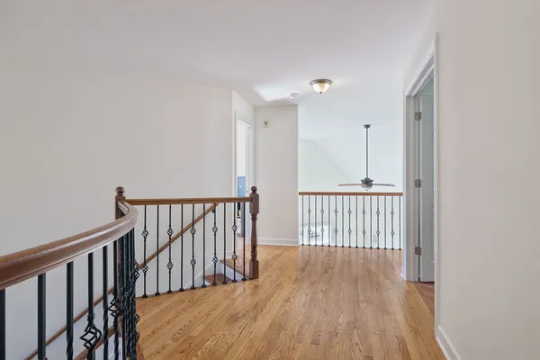 a view of a hallway with stairs