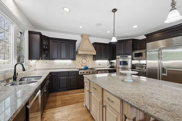 a kitchen with counter top space cabinets and stainless steel appliances