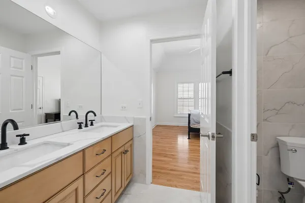 a bathroom with a toilet and shower