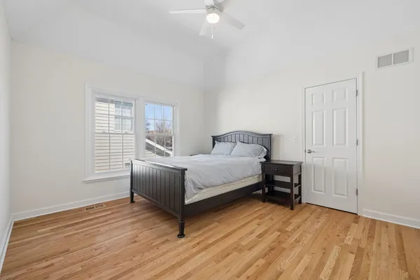 a kitchen with stainless steel appliances granite countertop a stove and a white cabinets