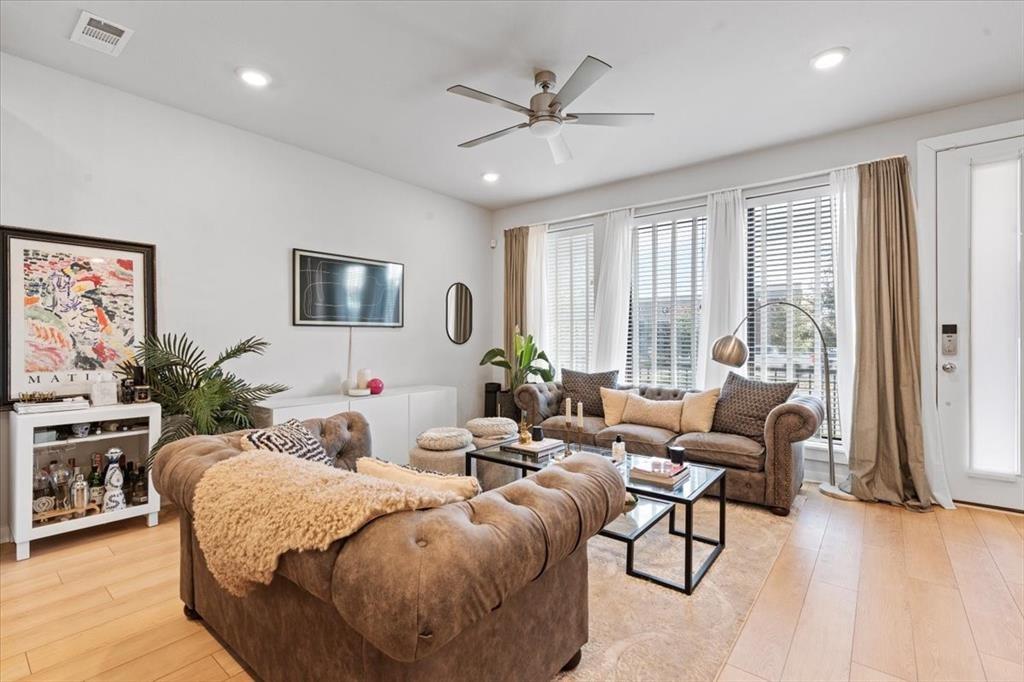 2268 Rook Drive Dallas, TX 75211 - Photo 5 of 13 The living area features light-toned wood flooring, recessed lighting, and a ceiling fan