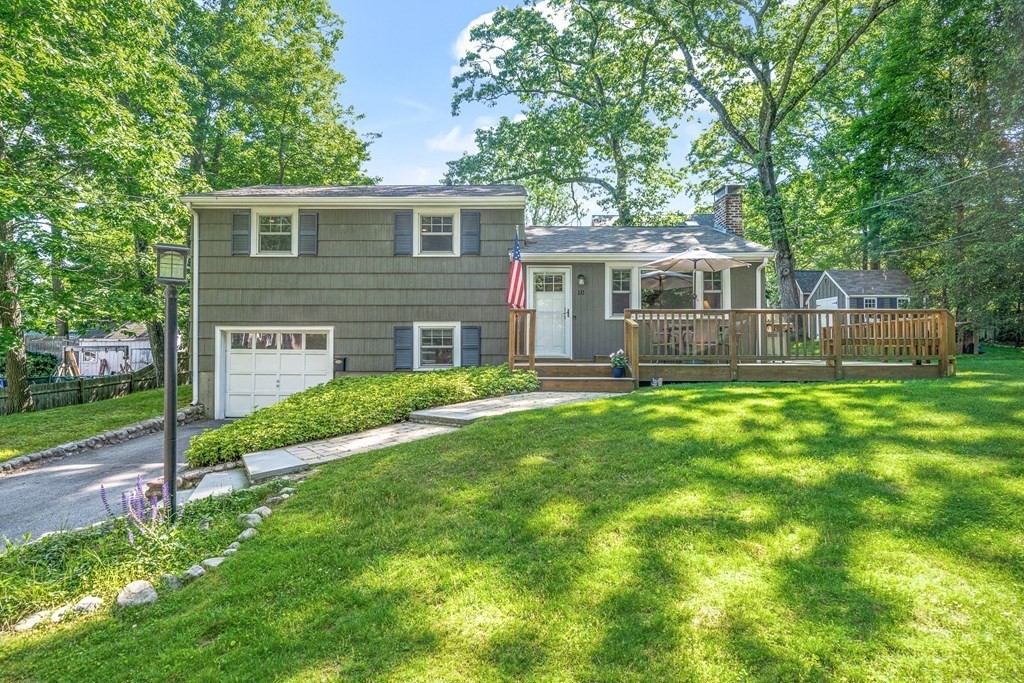 10 Winslow Road Natick, MA 01760 - Photo 1 of 20 a view of a house with a yard and plants