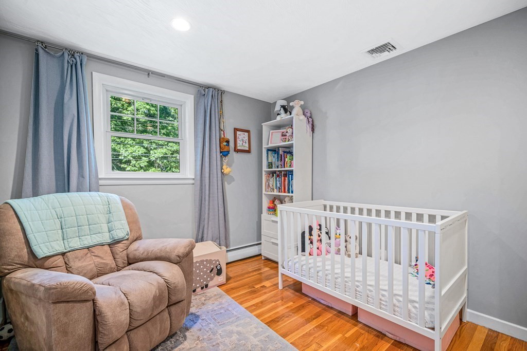 10 Winslow Road Natick, MA 01760 - Photo 11 of 20 a bedroom with furniture and a bed