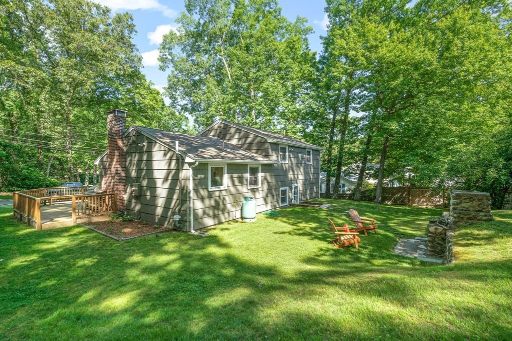 10 Winslow Road Natick, MA 01760 - Photo 16 of 20 a view of a house with a yard and sitting area