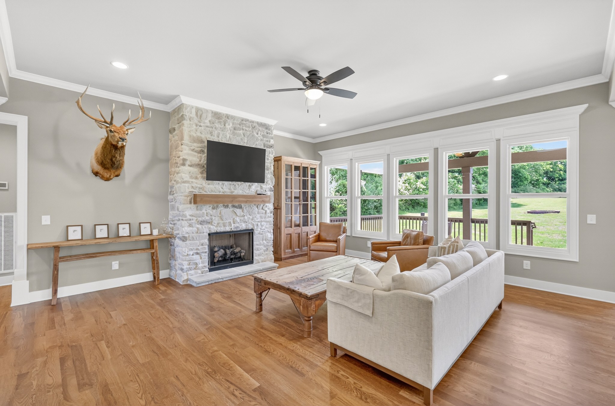 1176 Iron Bridge Road Columbia, TN 38401 - Photo 6 of 53 a living room with furniture a fireplace and a flat screen tv